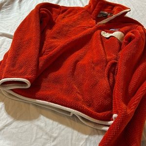 Cute, warm Patagonia women’s orange size Medium pullover.